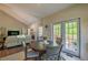 Cozy dining area adjacent to the living room with access to outdoor deck at 1030 Blankets Creek Dr, Canton, GA 30114