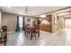 Charming dining area adjacent to the kitchen boasts a ceiling fan and tile flooring at 1030 Blankets Creek Dr, Canton, GA 30114