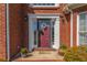 Close-up of the welcoming front door with wreath and decorative plants at 1030 Blankets Creek Dr, Canton, GA 30114