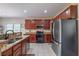 Updated kitchen with stainless appliances and granite countertops at 1030 Blankets Creek Dr, Canton, GA 30114