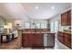 Open kitchen with granite countertop and stainless appliances at 1030 Blankets Creek Dr, Canton, GA 30114