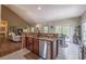 Open concept kitchen and dining with stainless steel appliances and granite counter at 1030 Blankets Creek Dr, Canton, GA 30114