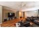 Spacious living room featuring hardwood floors, comfortable seating, and modern entertainment setup at 1030 Blankets Creek Dr, Canton, GA 30114