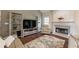 Cozy living room features vaulted ceilings, large windows, and fireplace at 1030 Blankets Creek Dr, Canton, GA 30114