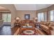 Cozy living room with hardwood floors, comfortable seating, and ample natural light at 1030 Blankets Creek Dr, Canton, GA 30114