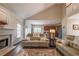 Living room with fireplace open to the kitchen at 1030 Blankets Creek Dr, Canton, GA 30114