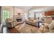 Bright living room featuring a cozy fireplace and comfortable seating at 1030 Blankets Creek Dr, Canton, GA 30114