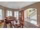 Warm living room with hardwood floors, plush sofas, and an entryway to the foyer at 1030 Blankets Creek Dr, Canton, GA 30114