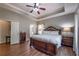 Comfortable main bedroom features decorative headboard, bedside tables, and access to the main bathroom at 1030 Blankets Creek Dr, Canton, GA 30114