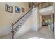 Elegant staircase with white banister and views of the home's interior at 1030 Blankets Creek Dr, Canton, GA 30114