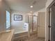 Bright bathroom with a separate tub and tiled shower, and elegant decor at 1800 Emory Ln # 98, Conyers, GA 30013