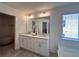 Elegant bathroom vanity with double sinks, quartz countertop, and modern lighting fixtures at 1800 Emory Ln # 98, Conyers, GA 30013