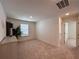 Well-lit bedroom with carpet, neutral walls, and two doorways for easy access at 1800 Emory Ln # 98, Conyers, GA 30013