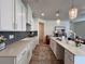 Stunning kitchen with white countertops, stainless appliances, and seamless flow into the living area at 1800 Emory Ln # 98, Conyers, GA 30013