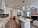 Beautiful kitchen featuring a large island, pendant lights, and stainless steel appliances open to living space at 1800 Emory Ln # 98, Conyers, GA 30013