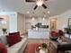 Bright living area with modern decor, ceiling fan, and open view to kitchen area for easy entertaining at 1800 Emory Ln # 98, Conyers, GA 30013