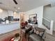 Stylish living space with pendant lighting over the kitchen island and modern staircase at 1800 Emory Ln # 98, Conyers, GA 30013