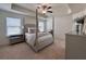 Tranquil main bedroom with a four-poster bed, tray ceiling, and natural light at 1800 Emory Ln # 98, Conyers, GA 30013