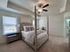 Bright, well-lit main bedroom featuring a tray ceiling and ample natural light at 1800 Emory Ln # 98, Conyers, GA 30013