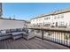 Spacious deck with comfortable outdoor seating and a view of the townhome community at 2384 Provence Park Way, Decatur, GA 30033