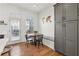 Cozy dining nook with a built-in bench, table, and chairs set by a window, adjacent to the modern kitchen at 2384 Provence Park Way, Decatur, GA 30033