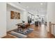 Charming dining area with hardwood floors, a stylish rug, modern art, and an open layout to the kitchen at 2384 Provence Park Way, Decatur, GA 30033
