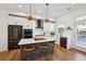 Modern kitchen with white cabinetry, a center island with seating, and stainless-steel appliances for gourmet cooking at 2384 Provence Park Way, Decatur, GA 30033