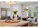 Bright kitchen with a marble island countertop, stainless steel appliances, and natural light from large windows at 2591 Apple Valley Rd, Brookhaven, GA 30319