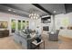 Spacious living room featuring a fireplace, stylish furniture, hardwood flooring, and access to an outdoor deck at 2591 Apple Valley Rd, Brookhaven, GA 30319