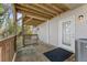 The home's covered back porch has wood railings and a door to the home at 1661 Paddlewheel Dr, Marietta, GA 30062
