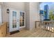 The covered back porch has wood flooring and includes a door with glass pane windows at 1661 Paddlewheel Dr, Marietta, GA 30062