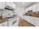 Bright kitchen featuring white cabinets, stainless steel appliances, and modern finishes at 1661 Paddlewheel Dr, Marietta, GA 30062