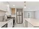 The kitchen has white cabinets and stainless steel appliances at 1661 Paddlewheel Dr, Marietta, GA 30062