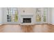 Spacious living room featuring a fireplace and large windows for natural light at 1661 Paddlewheel Dr, Marietta, GA 30062