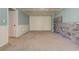Large unfinished basement space with stone accent wall and paneled ceiling at 189 Meadow Spring Dr, Temple, GA 30179