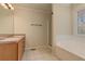 Bathroom features a large soaking tub, walk-in shower, and a dual sink vanity at 189 Meadow Spring Dr, Temple, GA 30179