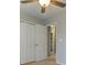 Bedroom with ceiling fan, carpet, closet, and view to hallway at 189 Meadow Spring Dr, Temple, GA 30179
