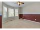 Bedroom with carpeting, three windows, and two-tone paint at 189 Meadow Spring Dr, Temple, GA 30179
