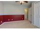 Bedroom with carpeting, two-tone paint, closet doors, and door to hallway at 189 Meadow Spring Dr, Temple, GA 30179