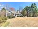 Cozy single-story home with stone and siding exterior, set on a large lot with mature trees at 189 Meadow Spring Dr, Temple, GA 30179