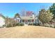 Single-story home featuring a stone and siding facade, enhanced by a neat front lawn and mature trees at 189 Meadow Spring Dr, Temple, GA 30179