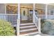 Close-up of a welcoming front porch with stone accents and a well-maintained entrance at 189 Meadow Spring Dr, Temple, GA 30179