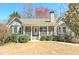 Charming single-Gathering home featuring a stone facade, a covered porch, and well-manicured landscaping at 189 Meadow Spring Dr, Temple, GA 30179