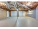 This unfinished garage offers ample space for vehicles and storage and features two garage door entrances at 189 Meadow Spring Dr, Temple, GA 30179
