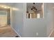 Hallway with view into the kitchen and bathroom at 189 Meadow Spring Dr, Temple, GA 30179