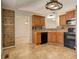 Bright kitchen with mosaic backsplash and wood accents opens to dining room at 189 Meadow Spring Dr, Temple, GA 30179