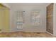 Bright dining room features a window, door to outside and wood accent wall at 189 Meadow Spring Dr, Temple, GA 30179