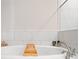 Clean bathroom with a large soaking tub and tiled backsplash at 1949 Skyfall Cir, Brookhaven, GA 30319