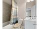 Functional bathroom featuring a bathtub with shower, toilet and a single sink at 1949 Skyfall Cir, Brookhaven, GA 30319