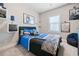 Comfortable bedroom with gray carpet, black accents, and interesting decor at 1949 Skyfall Cir, Brookhaven, GA 30319